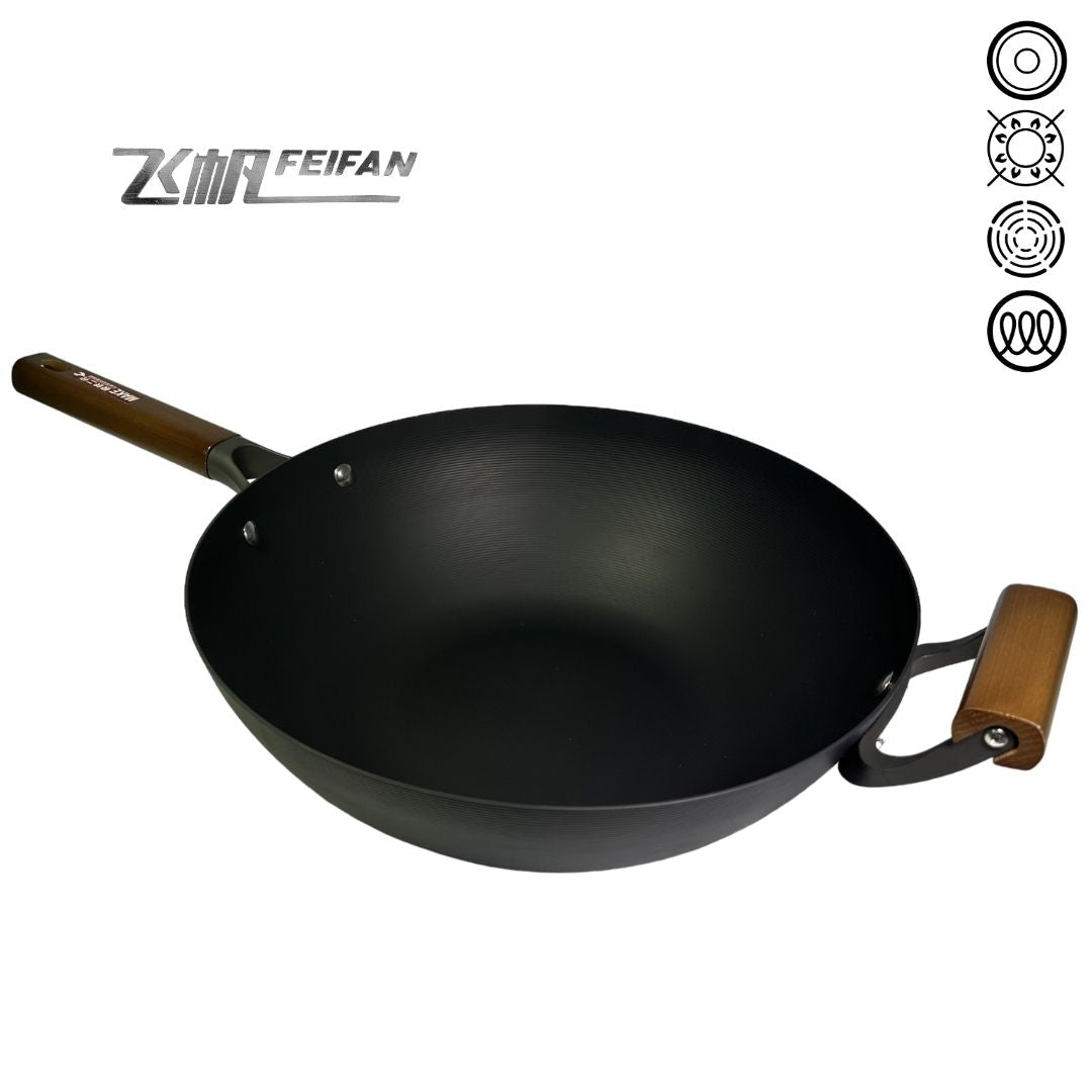 Angled close-up of FeiFan Cast Iron Wok (34cm), focusing on the sturdy handles and the sleek, rust-resistant nitride coating against a white background.